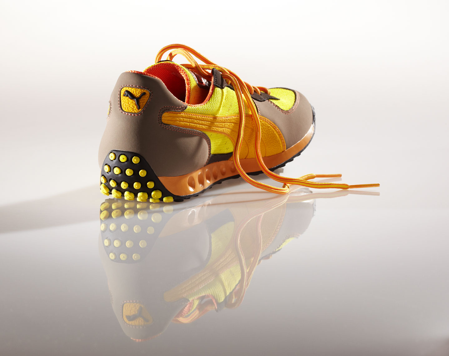 Product Photography Puma Gear Mens Fasion Casual Shoe Yellow Brown Orange with Reflection Chicago